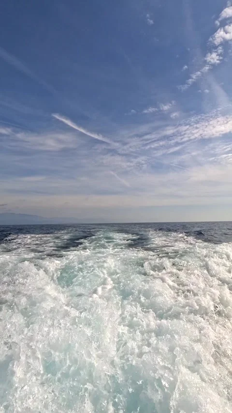 Vertical video of splashes on the sea from a high-speed sea motor vessel. Stock Footage 292538587
