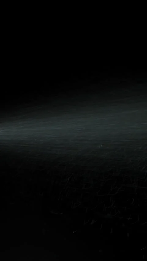 Vertical video. Spray Perfume from a Bottle, a Man's Hand Sprays Them on a Black Vidéo 268726628