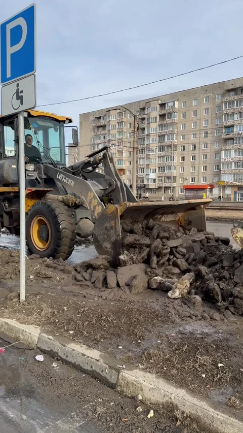 Vertical video of spring cleaning of city roads from ice and dirt Stock Footage 306029541