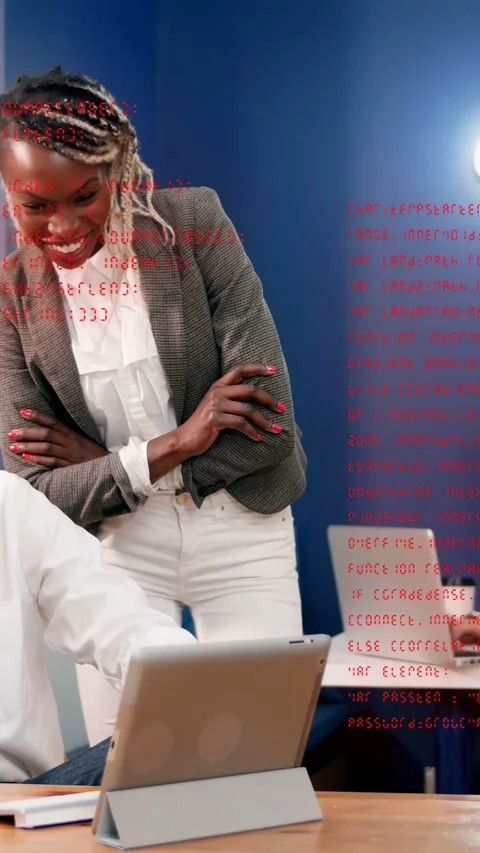 Vertical video: Standing lead watching man tapping tablet making code overlay Stock Footage 333464989