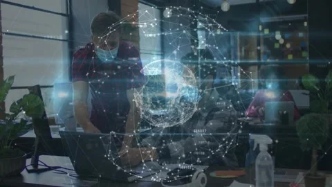 Vertical video: Standing man pointing at laptop seated dev typing initiating Stock Footage 332275571