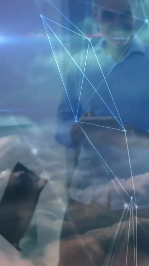 Vertical video: Standing man tapping tablet, checking meeting data, overlay Stock Footage 334546943