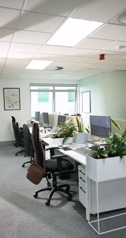 Vertical video: At start camera is panning from left across empty desks to Stock Footage 345217165
