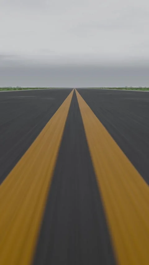 Vertical video: Starting dashcam moving along yellow center lines to show Stock Footage 346811387