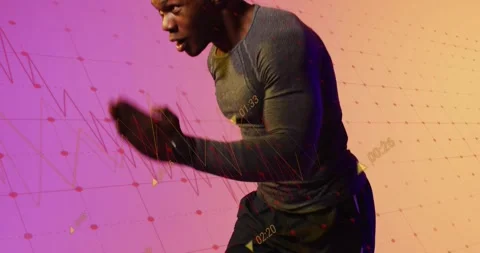 Vertical video: Starting low, athlete in gray top sprinting in studio, checking Stock Footage 331404367