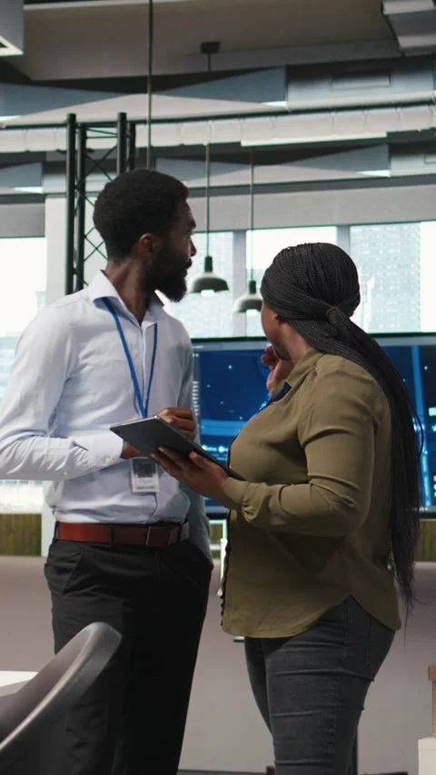 Vertical video Startup office coworkers doing brainstorming, developing AI Stock Footage 312709119