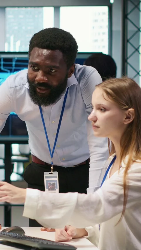 Vertical video Startup office manager congratulates young girl after developing Video stock 312768700