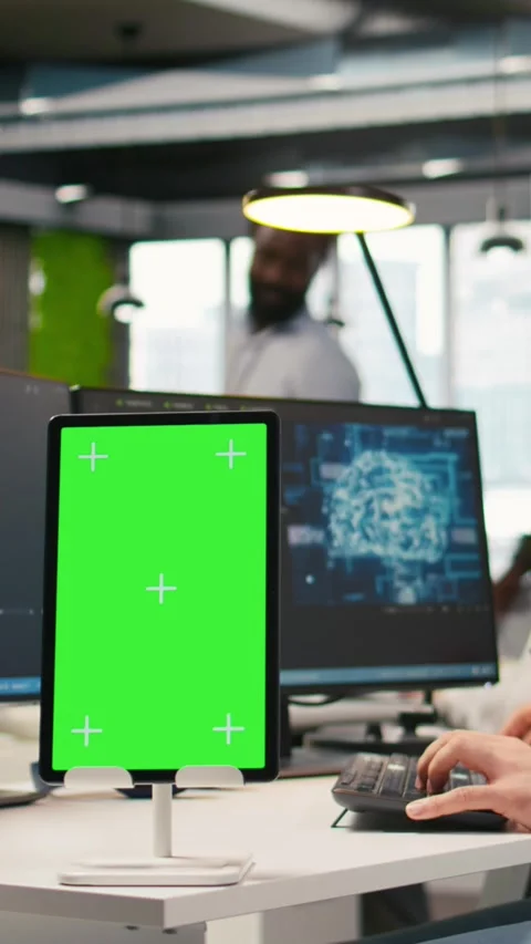 Vertical video Startup technician using isolated screen tablet, developing AI Stock Footage 312768689