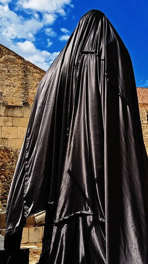 Vertical video: a statue covered with a black Stock Footage 316756522