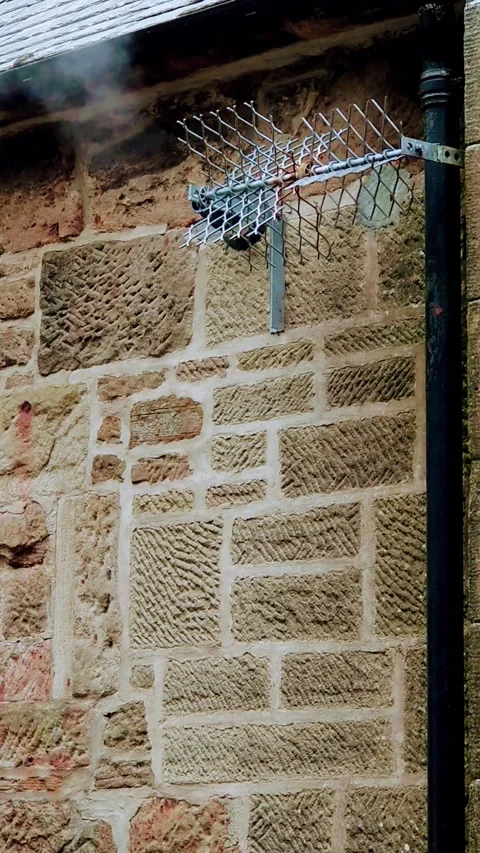 Vertical Video. Steam coming from a wall vent. Stock Footage 160076879