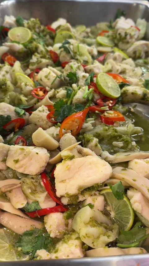 Vertical video of steamed fish in lime broth with chili garlic and herbs Stock-Footage 321182415