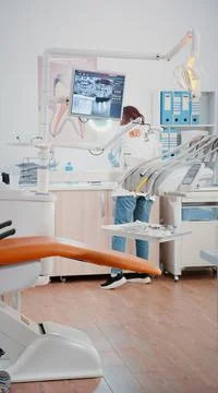 Vertical video: Stomatologist using chair with tools for dental care Stock Photos