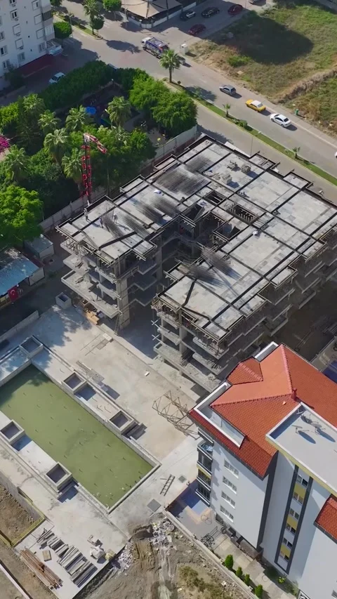 Vertical Video: Stone Cutting, Facade Installation, and Metal Framework Assembly Stock Footage 297749112