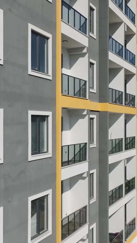Vertical Video: Stonework, Metal Assembly, and Facade Installation Captured on a Stock Footage 297751790