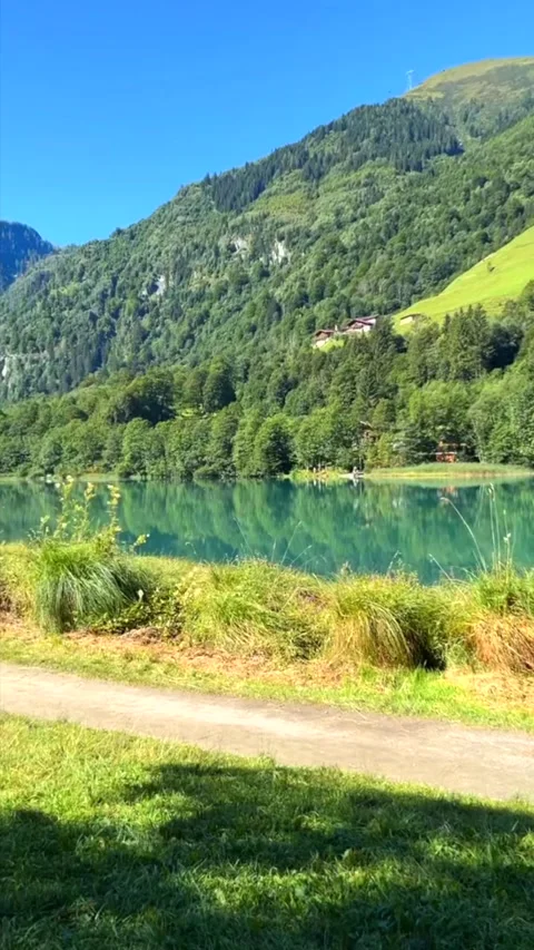 Vertical Video. Stories Format:Klamsee - mountain water reservoir, near Kaprun Stock Footage 249047674