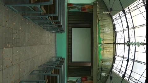 Vertical video strange empty abandoned street cinema with green walls Stock Footage 252310660