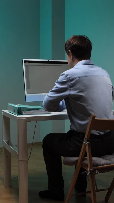 Vertical video stressed businessman working on a computer and having a Stock Footage 345530708