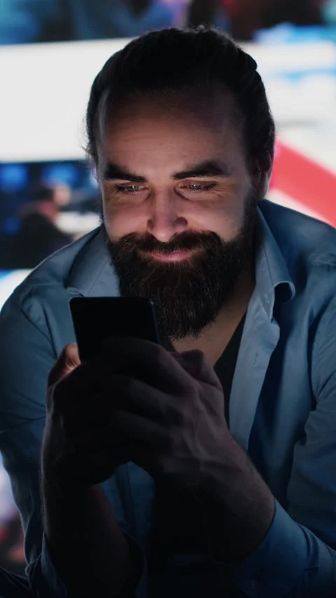 Vertical Video Stressed individual obsessively overuses his mobile phone social 스톡 동영상 310702018