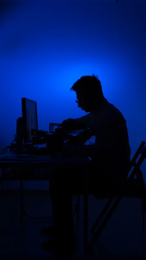 Vertical video Stressed man working on computer at night Stock Footage 318981413