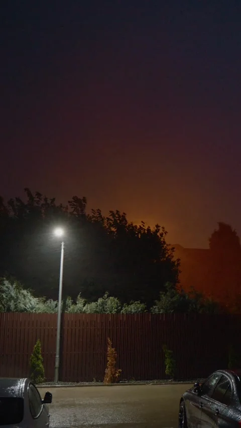 Vertical video Strong winds, heavy rain, and lightning strike homes and cars Stock Footage 323353670
