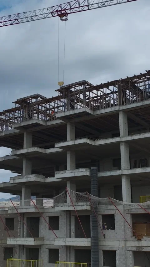 Vertical Video of Structural Wall Installation on Large Urban Building Project Stock Footage 342409462