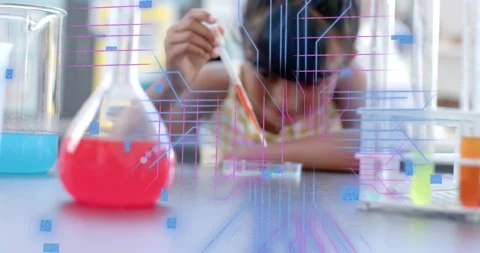 Vertical video: Student leaning pipetting sample at bench as overlay showing Stock Footage 331197655