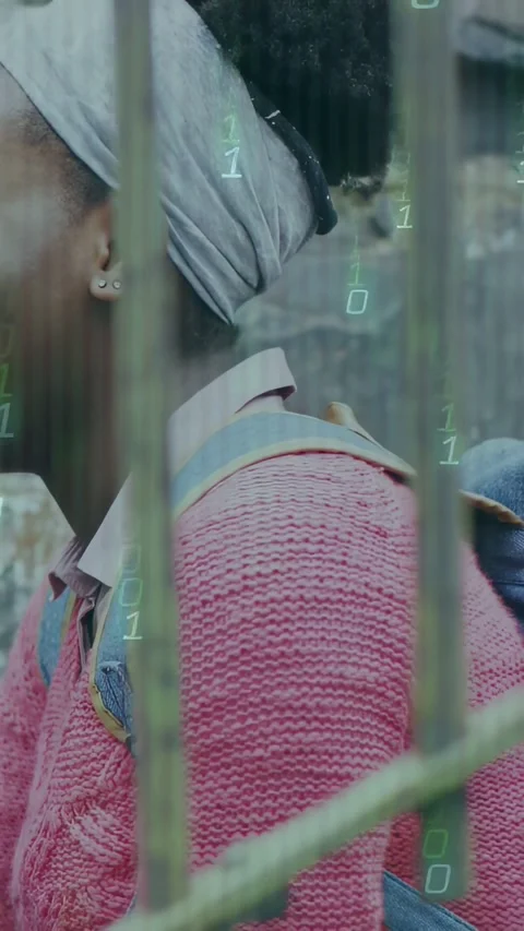 Vertical video: Student turning and laughing as green binary overlay appears Stock Footage 334386590