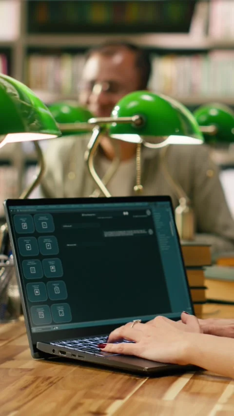 Vertical Video Student using AI study assistant interface typing on laptop at Stock Footage 336380768