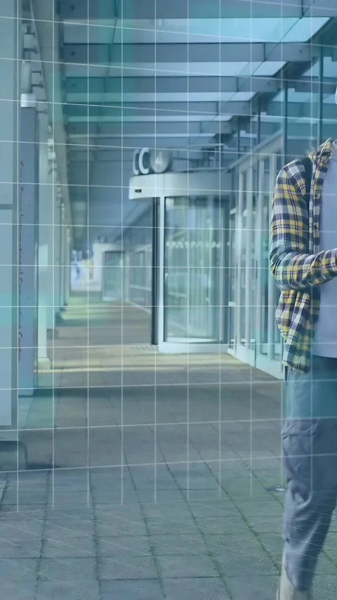 Vertical video: Student walking entry, tapping phone and accessing tech data Stock Footage 334025660
