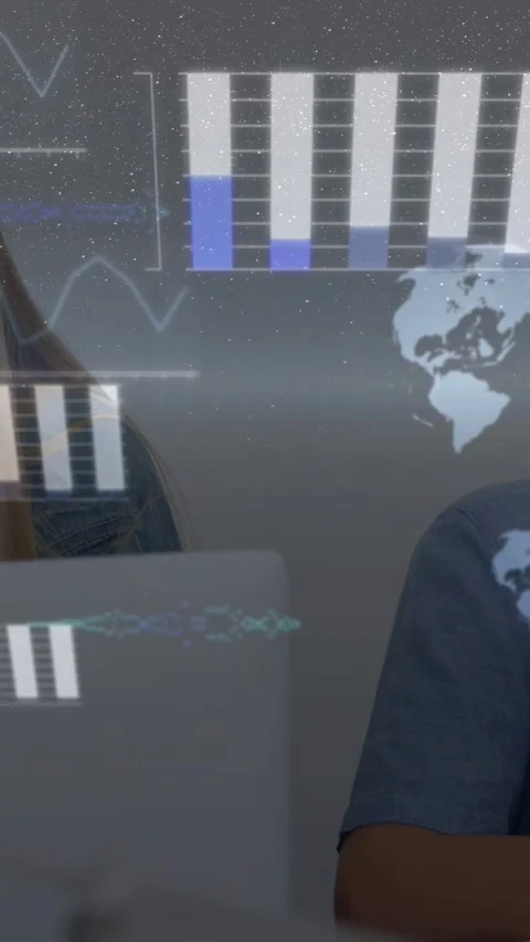 Vertical video: Students typing, causing HUD bars to fill and globe to spin for Stock Footage 332957520