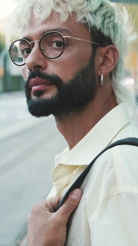 Vertical video, Stylish Man Waits At City Tram Stop Stock Footage 315401081