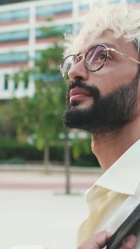 Vertical video, Stylish Man Walking Through City Park Stock Footage 303779273