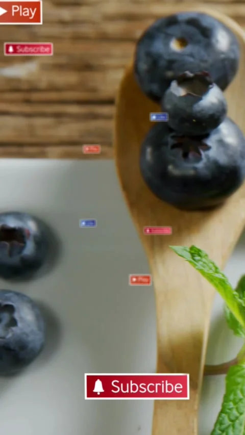 Vertical video: Sub button appearing drawing spoon entering with berries Stock Footage 334386915
