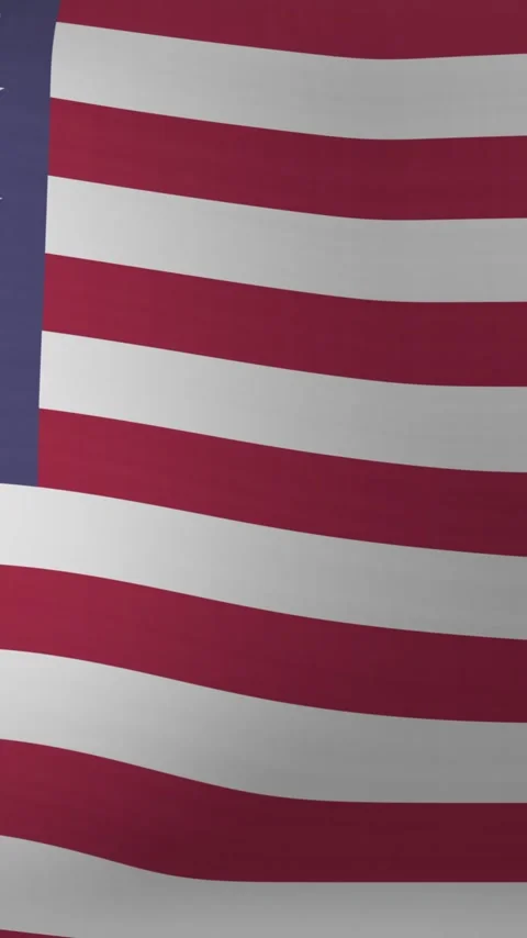 Vertical video: Subtle breeze starting US flag rippling, stars and stripes Stock Footage 348570893