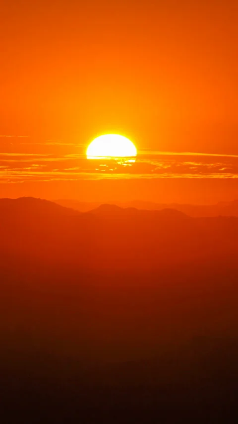 Vertical video of sun setting behind clouds Stock Footage 251494235