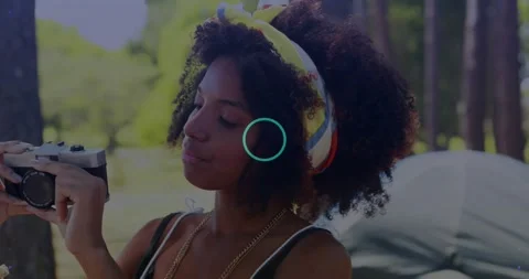 Vertical video: Sunlight glinting making woman raising and checking camera Stock Footage 334312472