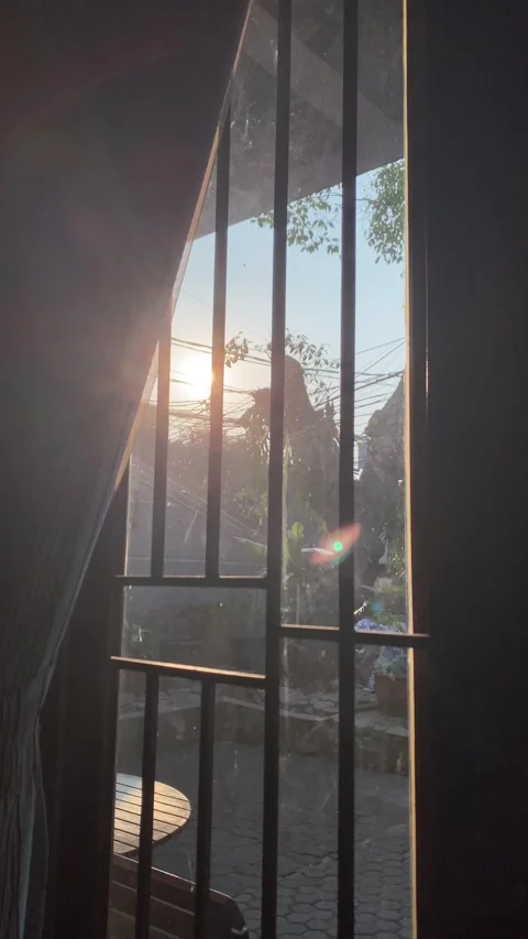Vertical video of sunset through window Stock Footage 343357499