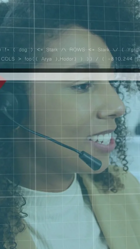Vertical video: Support agent speaking into headset causing code grid and red Stock Footage 332278331