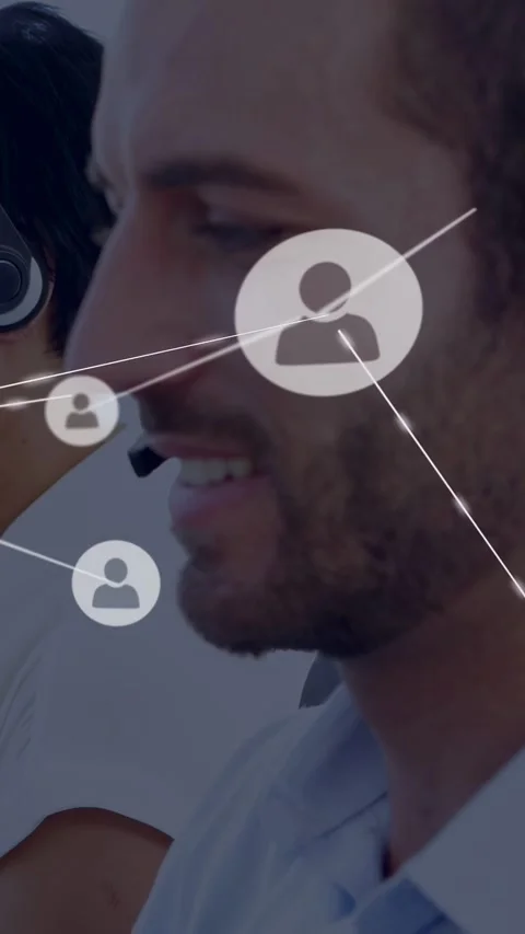Vertical video: Support agent speaking in headset sparking network nodes showing Stock Footage 333895795