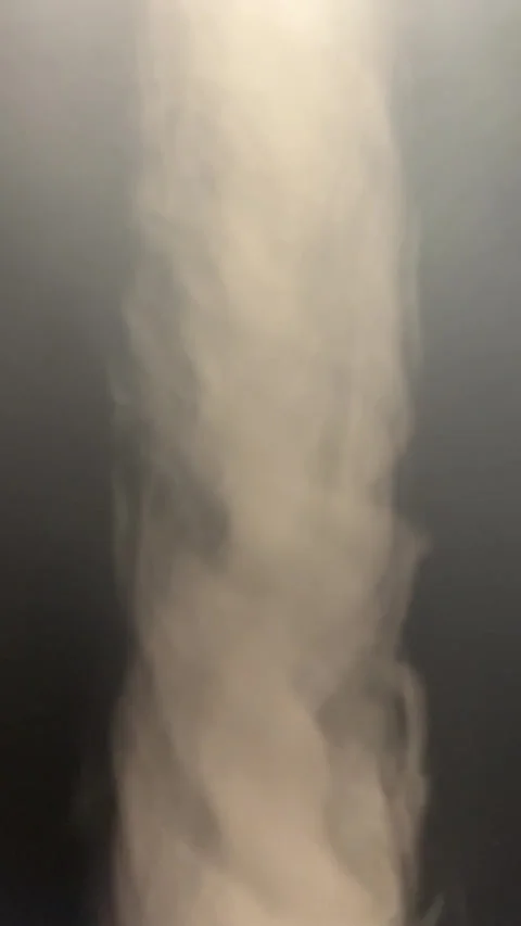 Vertical video of a swirl of smoke in slow motion Stock Footage 285462199
