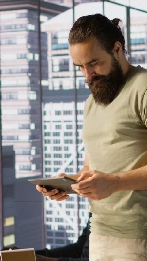 Vertical video System administrator checking machine learning results on tablet Stock Footage 319483226