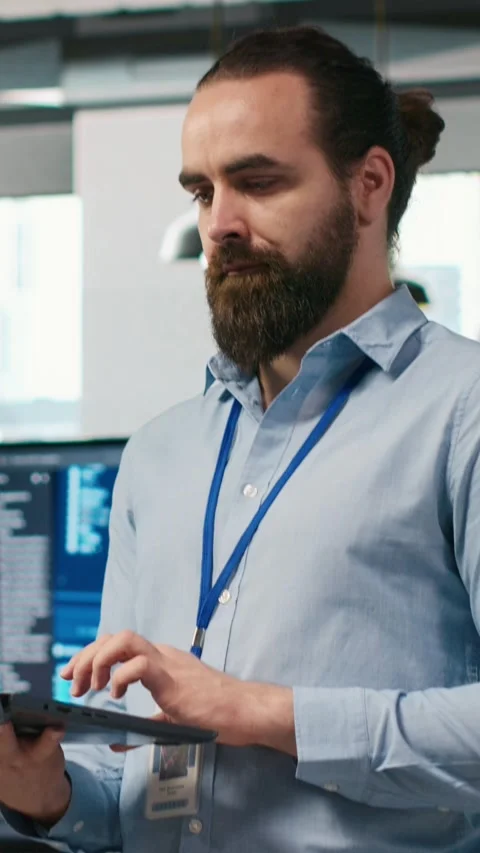 Vertical video System administrator in office developing software applications Stock Footage 312768139