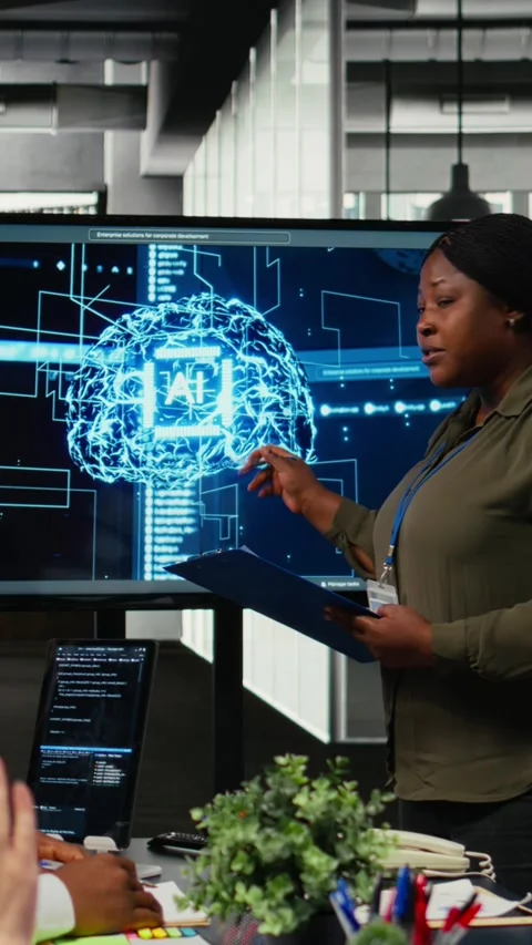 Vertical video System administrator presents AI chatbot reducing work volume to Stock Footage 323403985