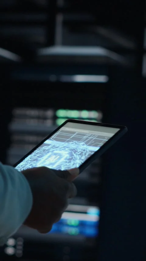 Vertical video System administrator walking in data center with modern Stock Footage 311547968