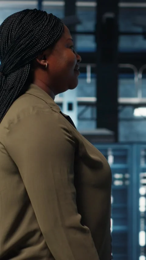 Vertical video System administrator working in data center to optimize network Stock Footage 316862882