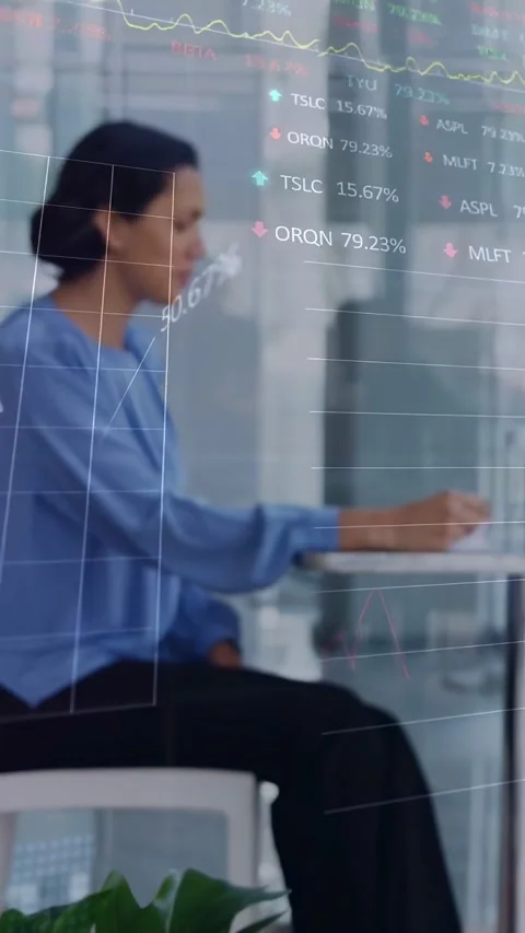 Vertical video: Tablet user tapping screen showing stock graphs while woman Stock Footage 334386569