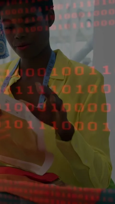 Vertical video: Tailor unfolding fabric, aligning pattern with red binary data Stock Footage 334382282