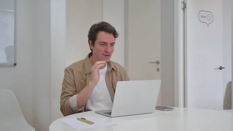 Vertical Video, Talking Young Creative Man Doing Video Chat on Laptop Video stock 312913973