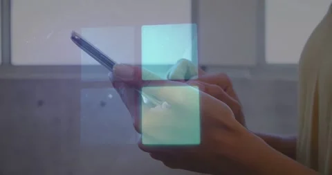 Vertical video: Tapping hands holding phone to interact with blue UI near 库存影片 331161505
