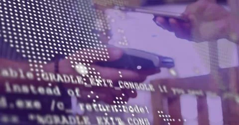 Vertical video: Tapping hands upon alert arriving at desk, holding two phones 스톡 사진